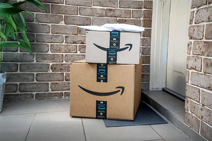 Image: Insured Amazon shipments sitting on a front porch.