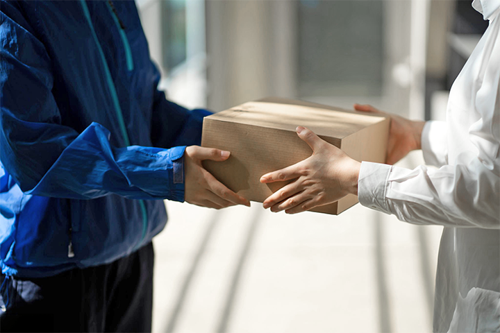 Image: A delivery driver handing off a successful delivery.