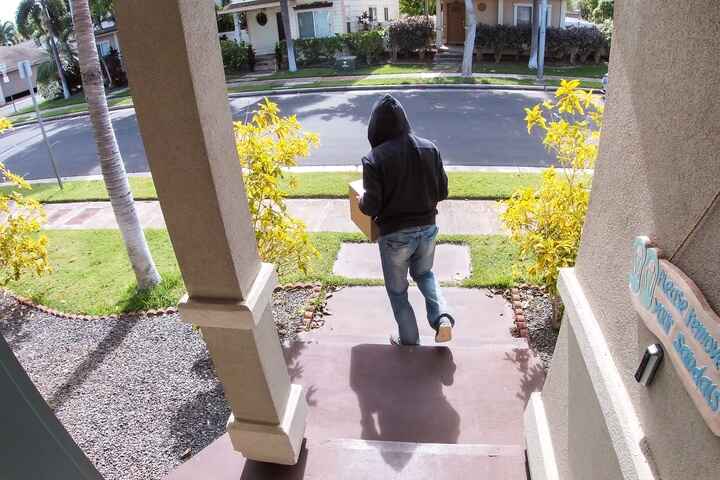 Person Taking Package From Porch