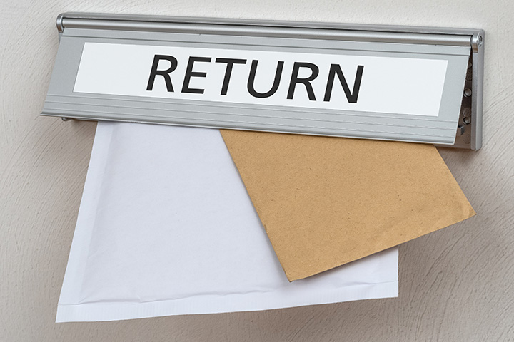 Image: Return slot with mail sticking out.