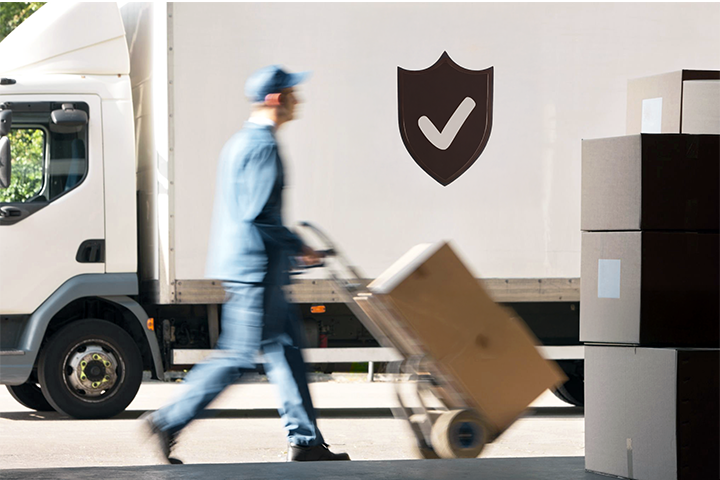 Image: Delivery worker moving boxes in front of a truck with a shield and checkmark symbol representing insured and protected shipments.