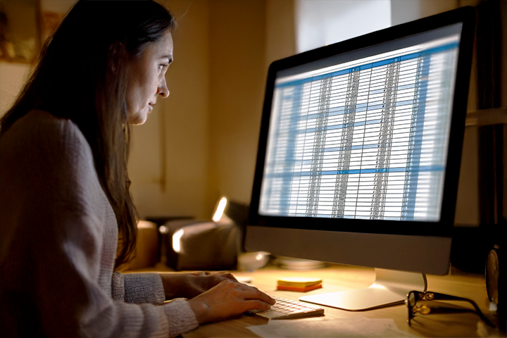 Image: A woman reviewing her shipment manifest before sending it to U-PIC.