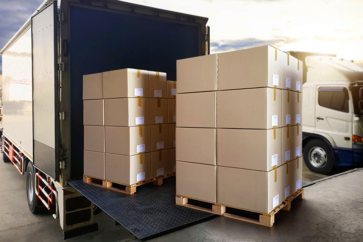Image: Freight on a pallet being loaded onto a truck.