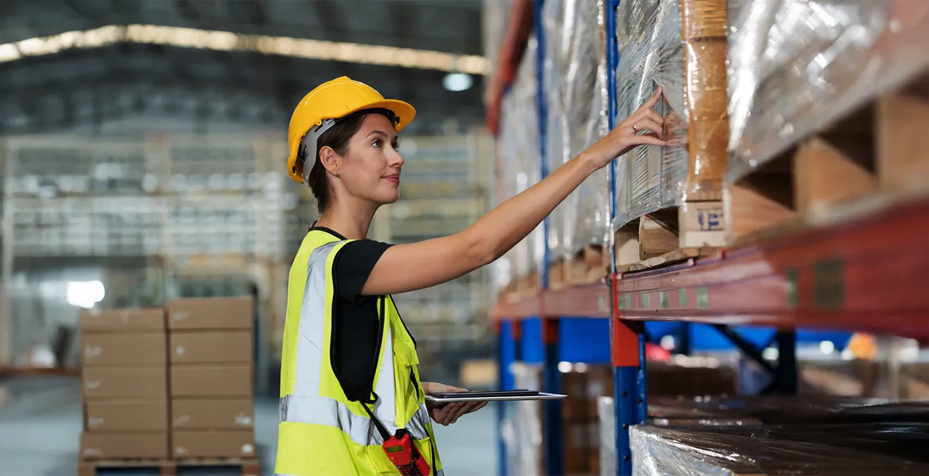 Image: A warehouse worker auditing parcels.