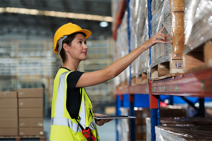 Image: A warehouse worker auditing parcels.