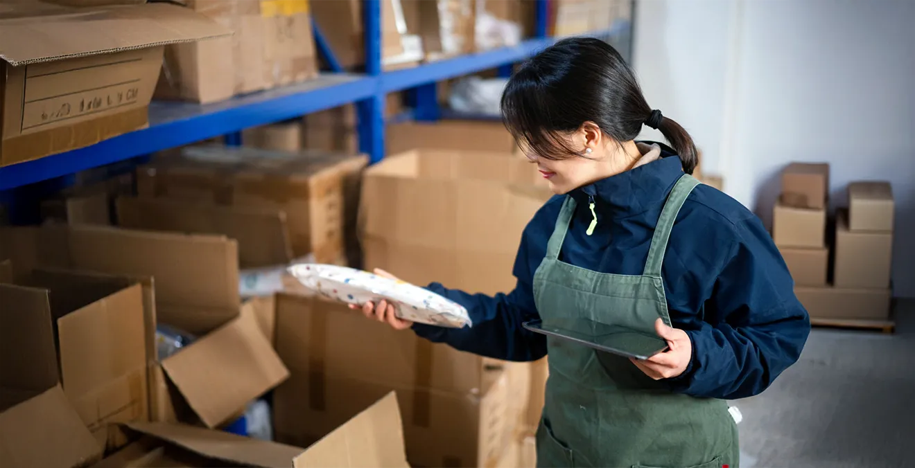Image: A warehouse worker pulling items for drop shipping.