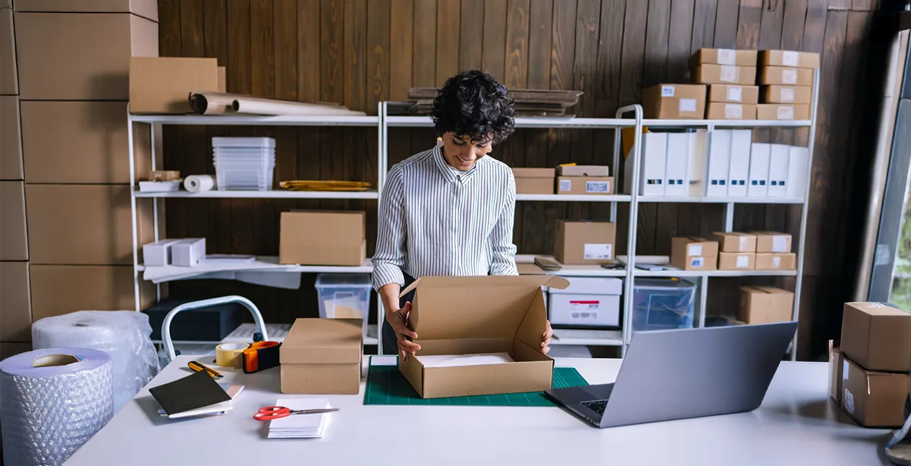 Image: A seller packaging an ecommerce order.