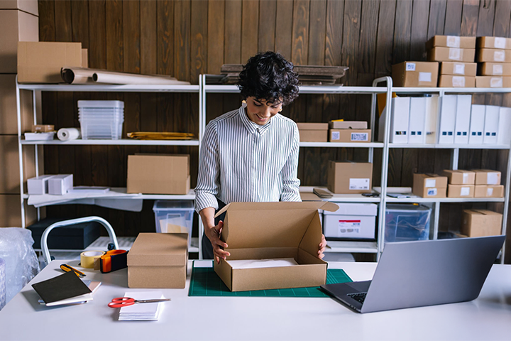 Image: A seller packaging an ecommerce order.