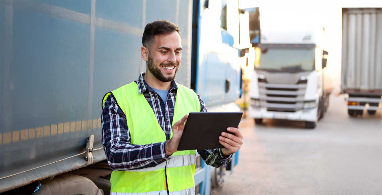Image: A worker using a transportation management system.